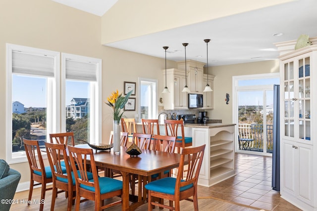 dining area featuring light tile patterned floors