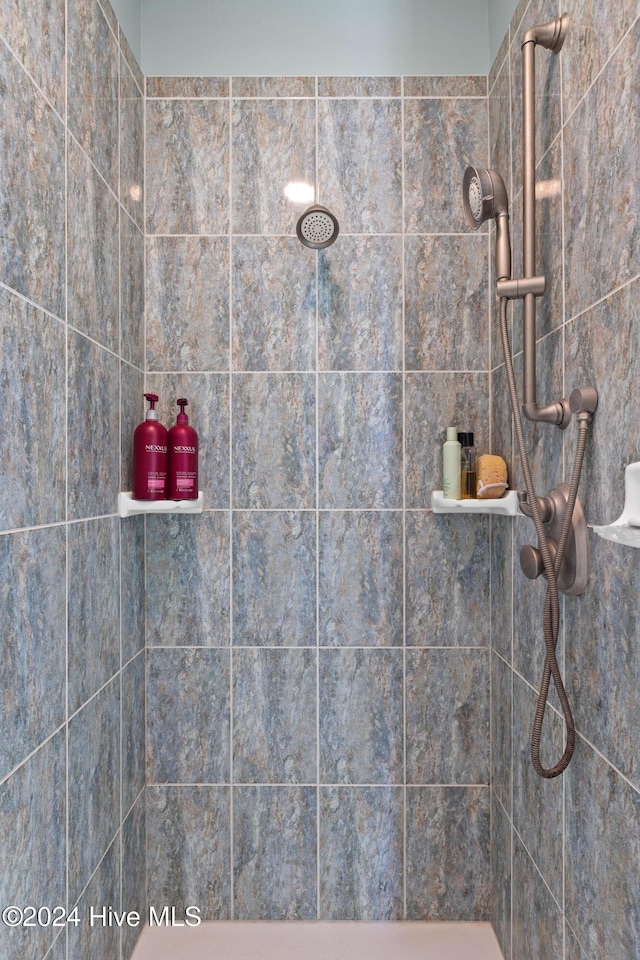 bathroom with a tile shower