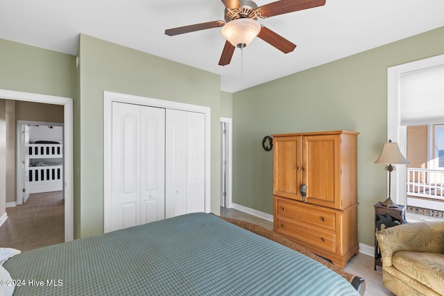 bedroom with ceiling fan and a closet