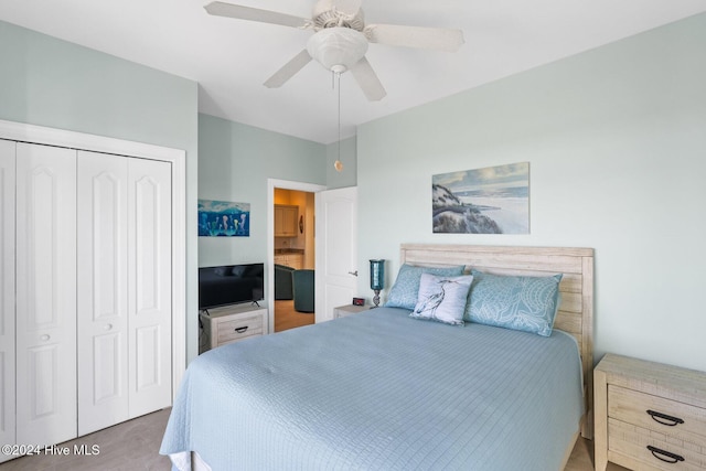 bedroom featuring ceiling fan and a closet