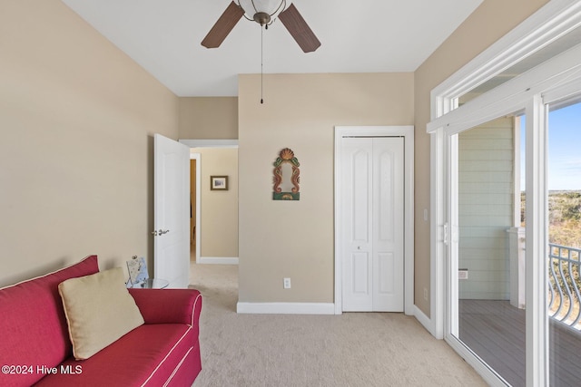 sitting room with light carpet and ceiling fan