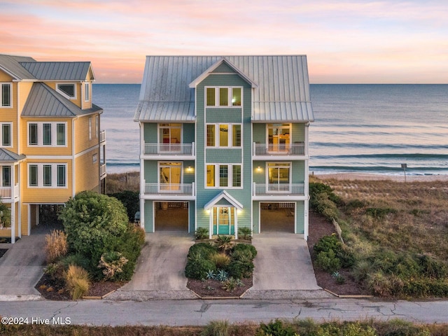 view of front of house with a water view