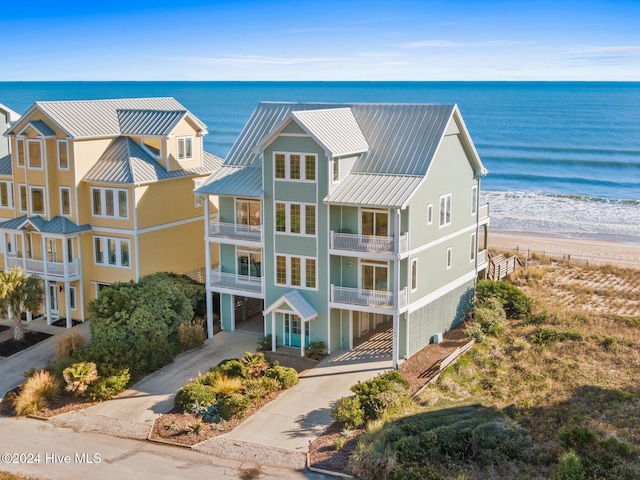 aerial view featuring a water view and a view of the beach