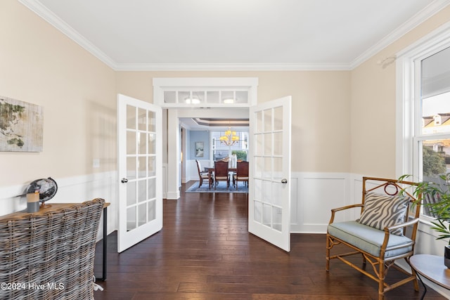 living area with french doors, dark wood-type flooring, and ornamental molding