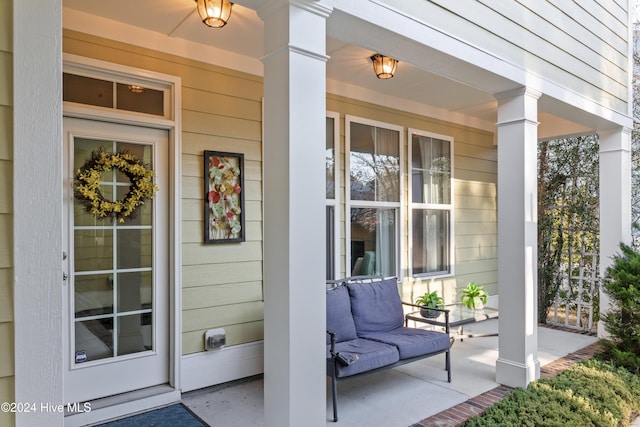 entrance to property featuring a porch