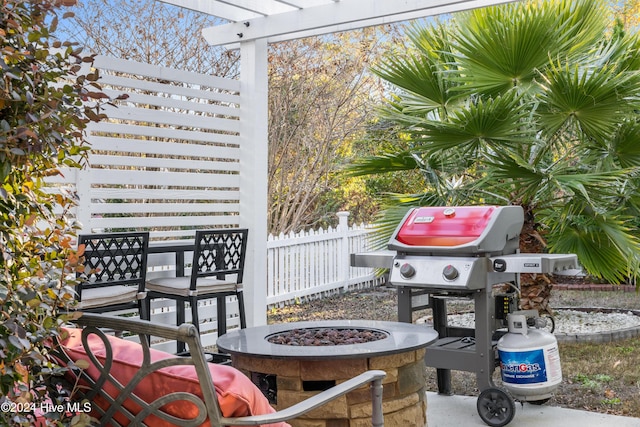 view of patio with an outdoor fire pit