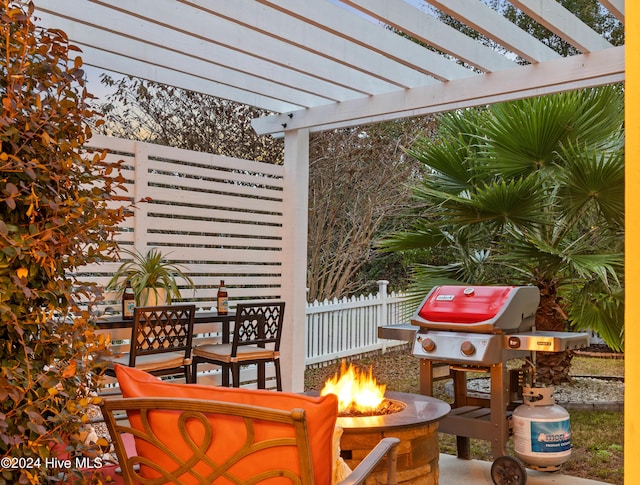 view of patio / terrace featuring a pergola and an outdoor fire pit