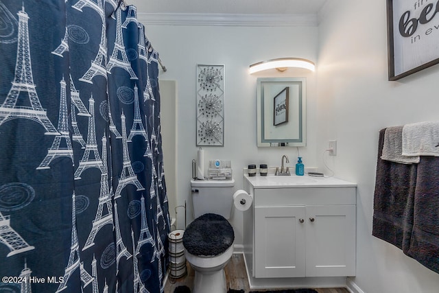 bathroom featuring hardwood / wood-style flooring, vanity, toilet, and ornamental molding