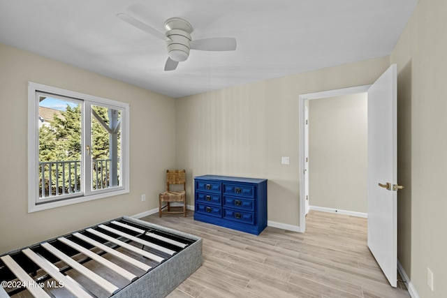 bedroom with ceiling fan and light wood-type flooring