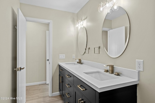 bathroom with hardwood / wood-style floors and vanity