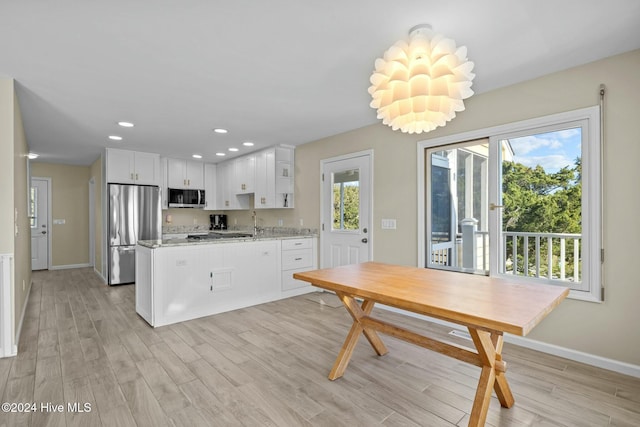 unfurnished sunroom featuring ceiling fan and plenty of natural light