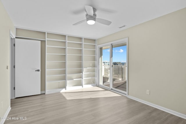 office area with ceiling fan and wood-type flooring