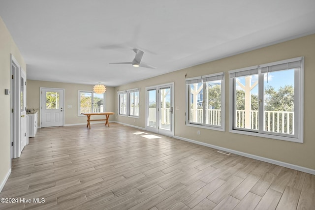 interior space with ceiling fan and light wood-type flooring