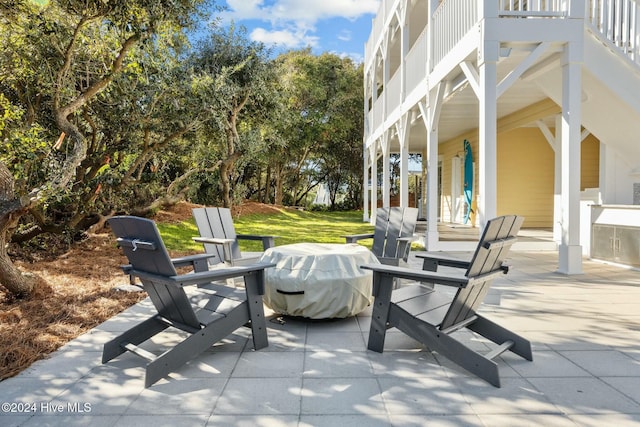 view of patio / terrace with a grill and a balcony