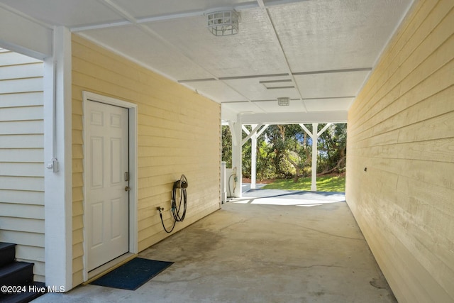 view of patio / terrace featuring a carport