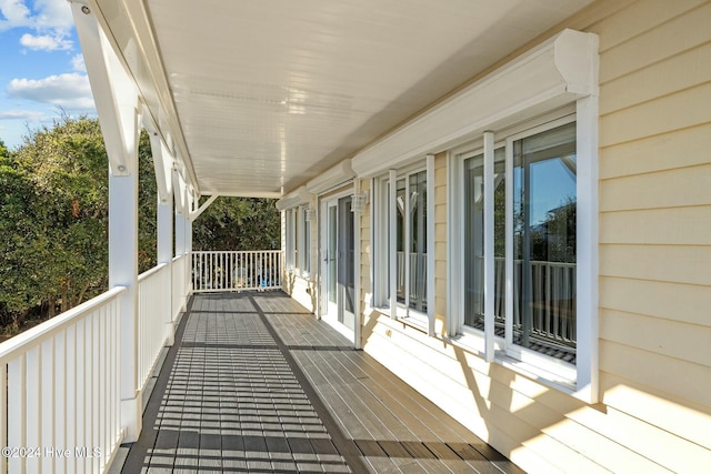 wooden terrace featuring covered porch