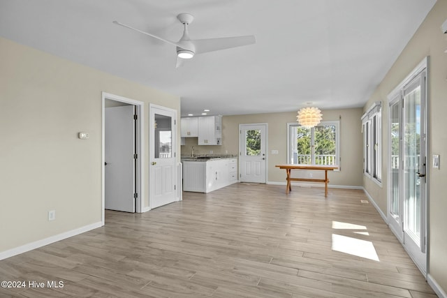 bedroom with ceiling fan and light hardwood / wood-style flooring