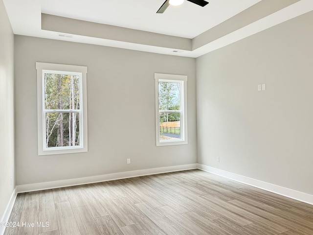 spare room featuring ceiling fan and light wood-type flooring