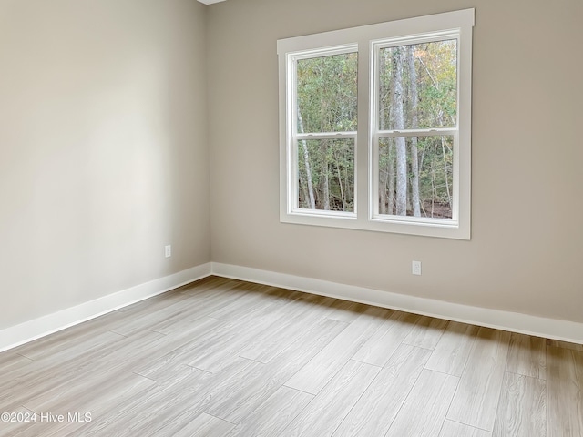 unfurnished room featuring light hardwood / wood-style floors