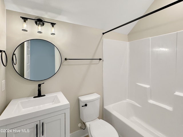 full bathroom featuring vanity,  shower combination, toilet, and lofted ceiling