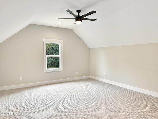 bonus room with ceiling fan, carpet floors, and vaulted ceiling