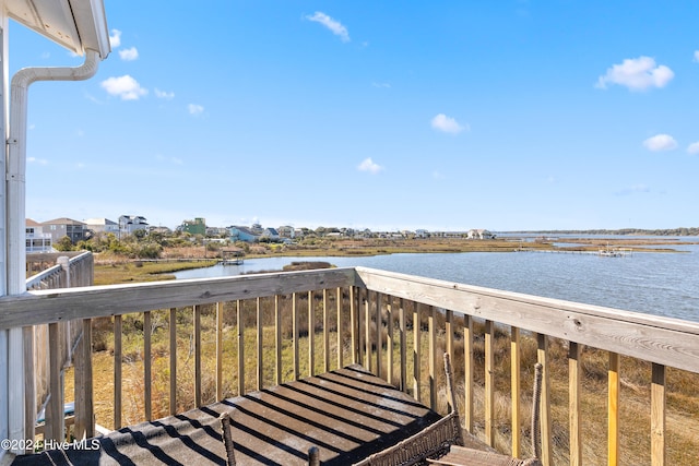 deck featuring a water view