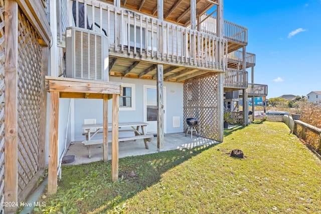 view of yard featuring a patio area and central air condition unit