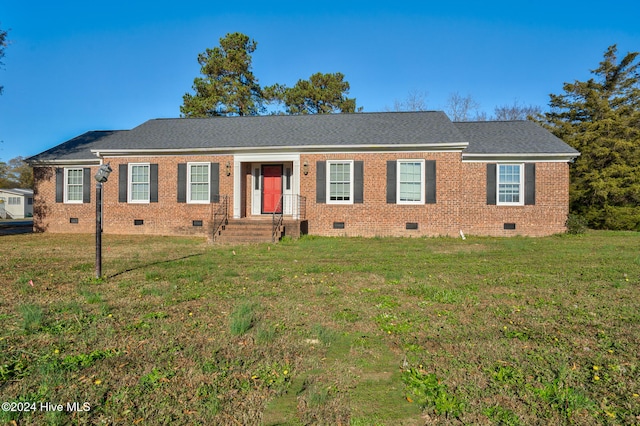 ranch-style home featuring a front yard