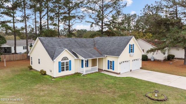 view of front of house featuring a garage and a front yard