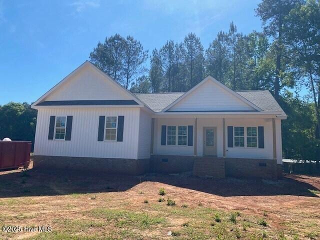 view of front of home with crawl space and covered porch