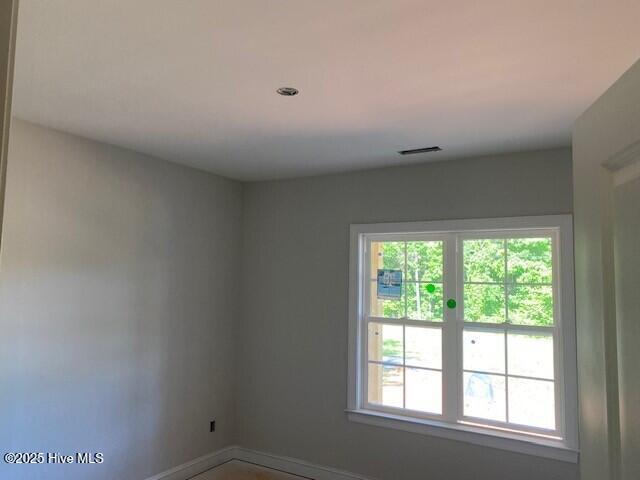 empty room with baseboards