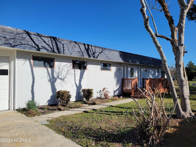 6111 Cutlass Ct, New Bern, NC 28560 - rear view of property with roof with shingles and a wooden deck