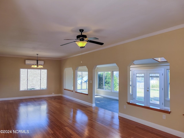 6111 Cutlass Ct, New Bern, NC 28560 - unfurnished room with wood finished floors, a chandelier, arched walkways, baseboards, and ornamental molding