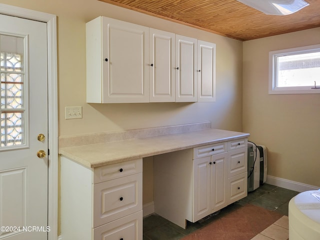 6111 Cutlass Ct, New Bern, NC 28560 - office area featuring wooden ceiling, dark tile patterned floors, and baseboards