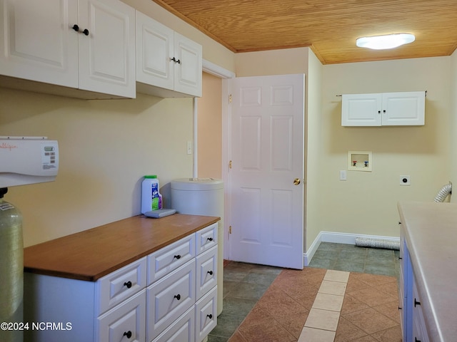 6111 Cutlass Ct, New Bern, NC 28560 - kitchen with wood ceiling, white cabinets, and baseboards