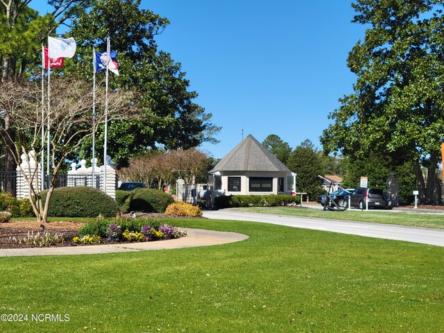 6111 Cutlass Ct, New Bern, NC 28560 - view of community featuring a yard