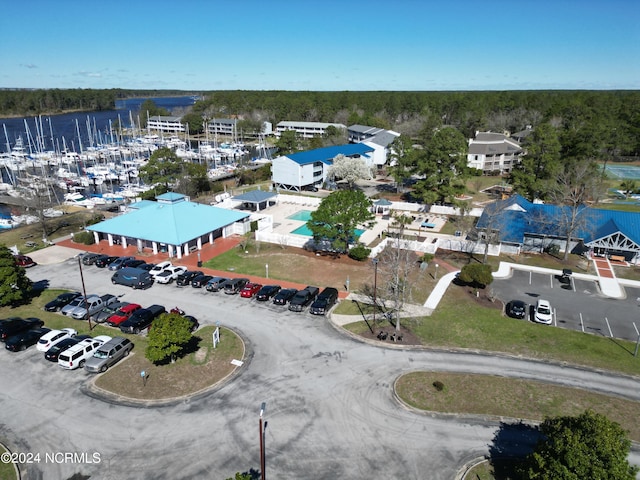 birds eye view of property with a water view