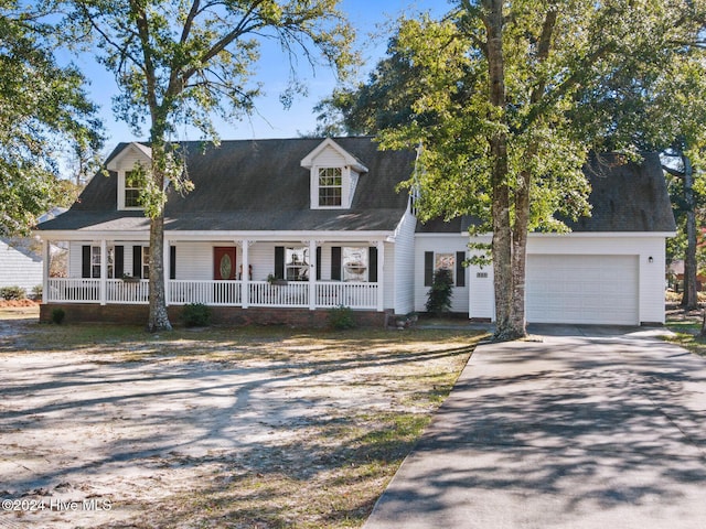 cape cod house with a garage