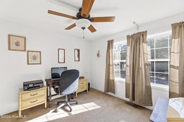 carpeted office with ceiling fan