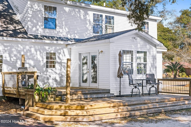 back of property featuring a wooden deck