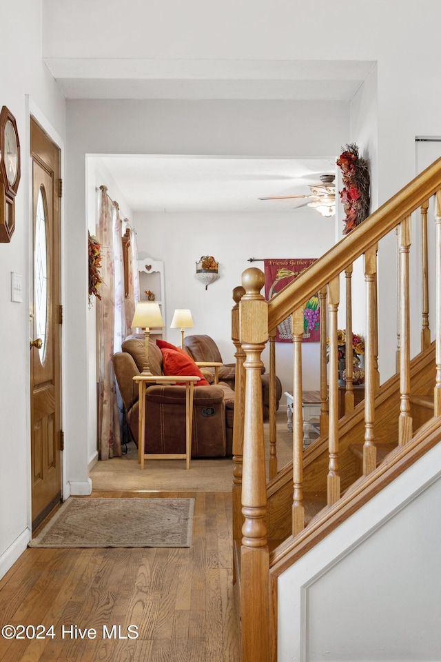 entryway with hardwood / wood-style floors and ceiling fan