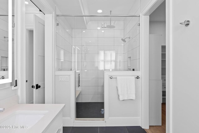 full bathroom featuring vanity, a shower stall, and recessed lighting