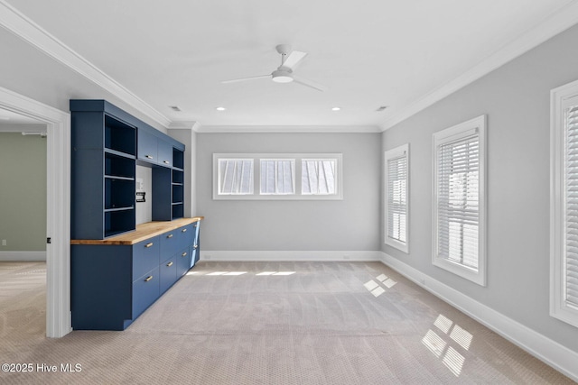 unfurnished living room featuring light carpet and crown molding