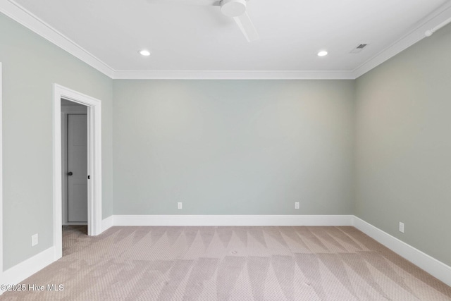 spare room with crown molding, light carpet, and recessed lighting