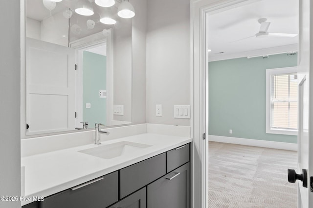 bathroom featuring baseboards and vanity