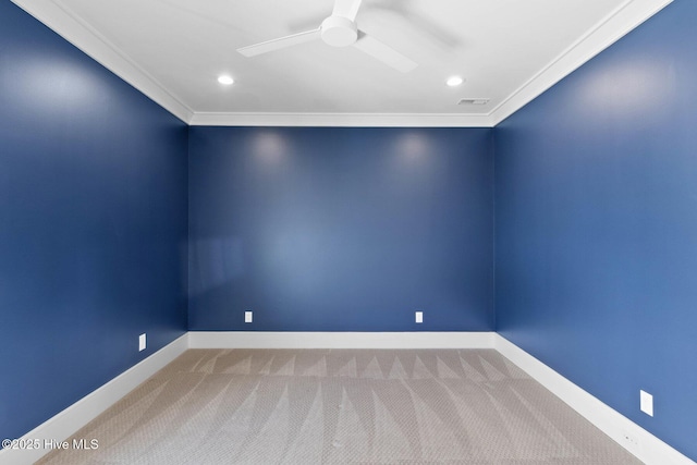 empty room with a ceiling fan, recessed lighting, baseboards, carpet flooring, and crown molding