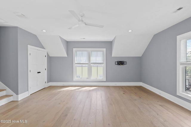 additional living space featuring baseboards, recessed lighting, light wood-type flooring, and a ceiling fan