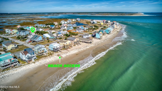 aerial view featuring a view of the beach and a water view