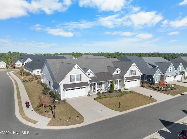 view of front of home with a porch and a garage