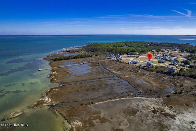 bird's eye view featuring a water view and a beach view